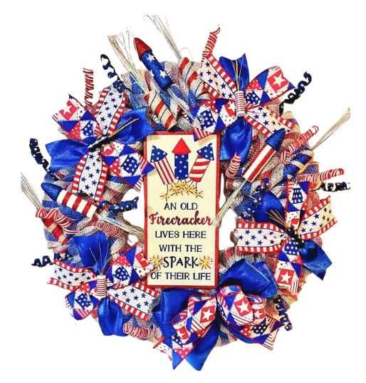 Decorative July 4th wreath with Firework theme and text "An Old Firecracker Lives Here with the Spark of their Life".
